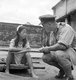 Burma / Myanmar: Rangoon, Burma. August 8, 1945. A young ethnic Chinese woman who was in one of the Imperial Japanese Army's 'comfort battalions' is interviewed by a British officer